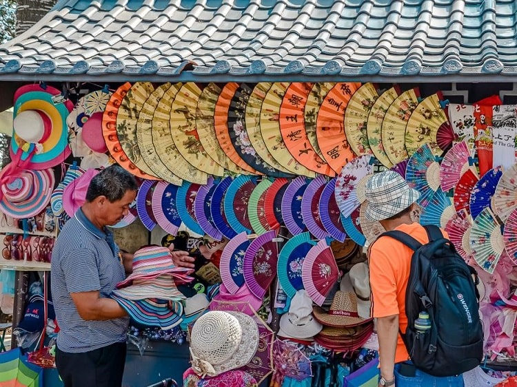 tourist shop in china selling fans and hats