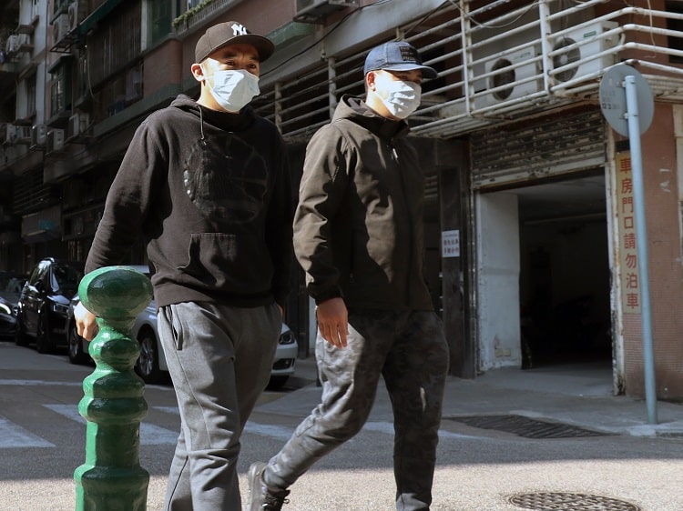 Chinese men wearing face masks