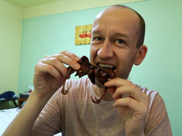 Mike eating quail in Chengdu