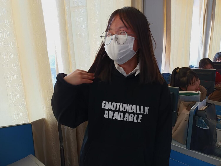 chinese teenager wearing chinglish shirt