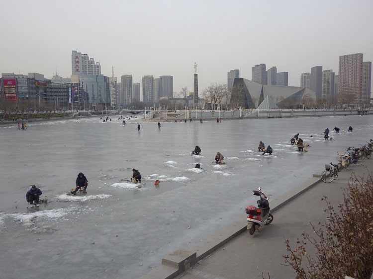 Tianjin ice fishing in river