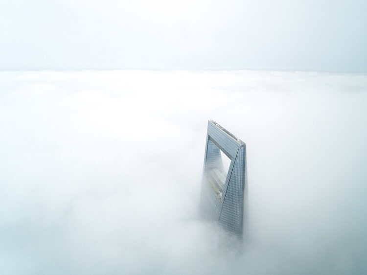 Shanghai World Financial Center covered in fog