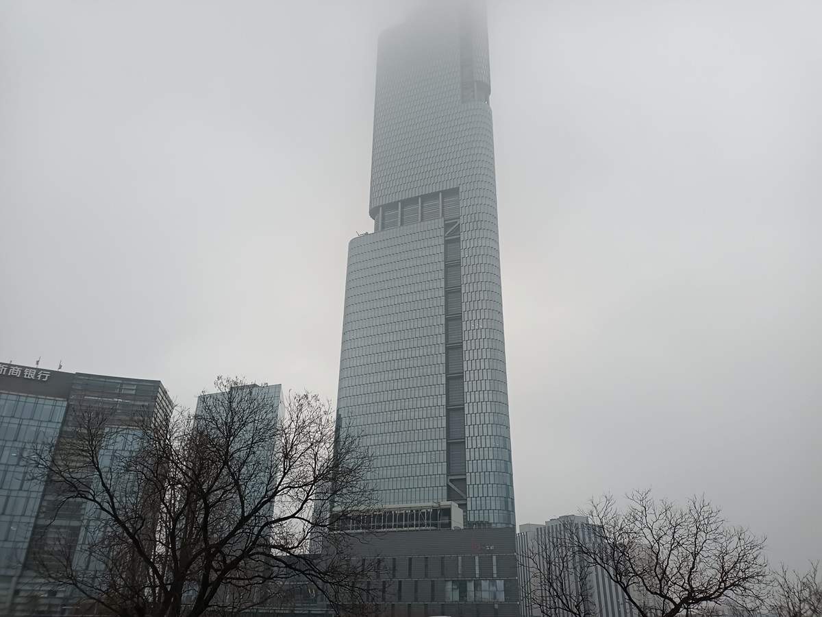 Zifeng Tower covered in fog