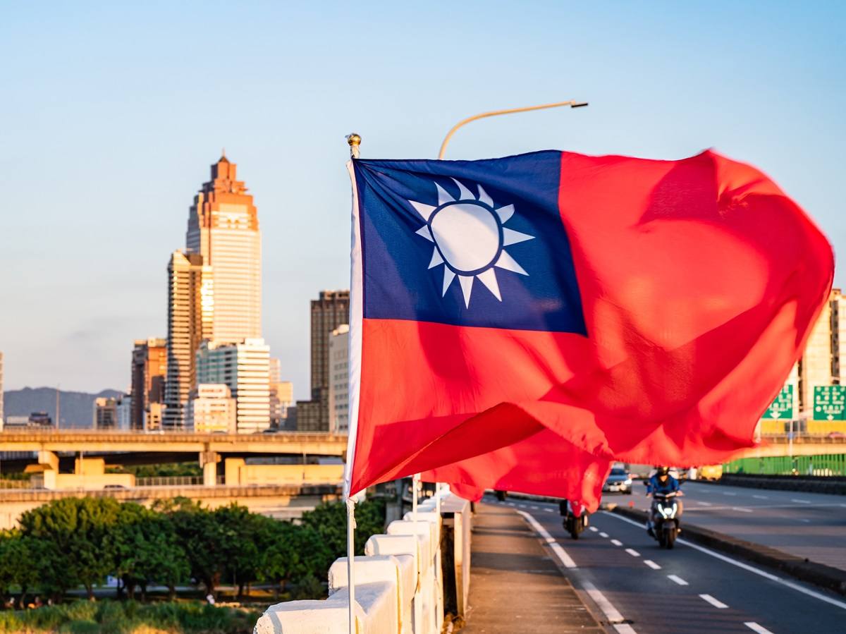 Taiwan flag in front of city buildings